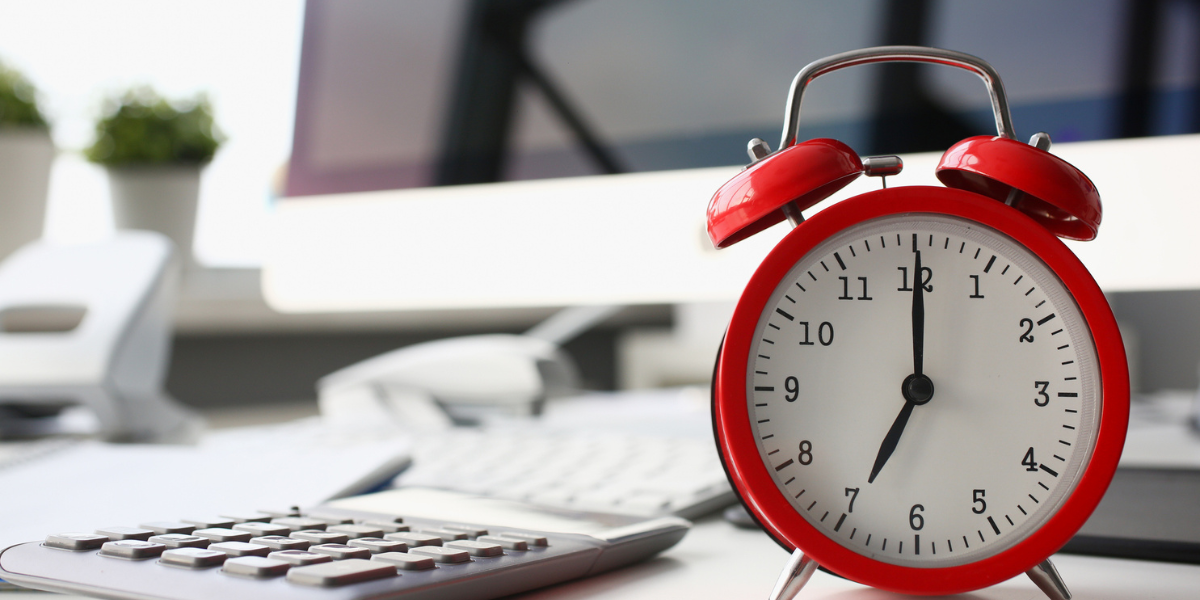 Alarm clock on a desk - 4 Ways Grantmakers Can Streamline Reporting