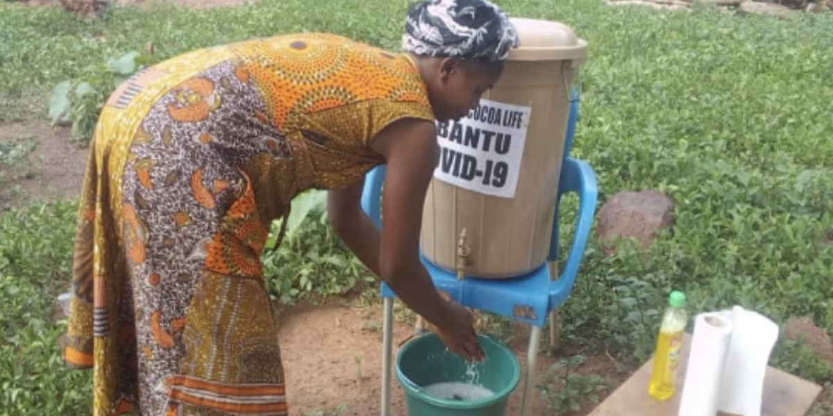 Woman washing hands - ABANTU for Development